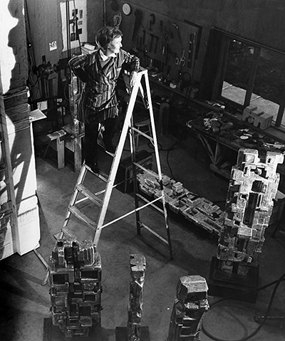 Elza on ladder in Victoria studio. Photo: Ken McAllister